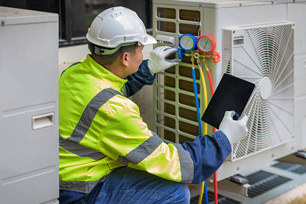 Professional Hvac technician working in Essex, MO